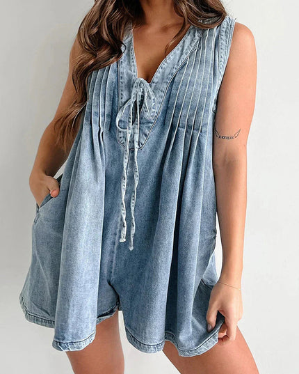 Denim mini dress front view showing tie closure and pocket details