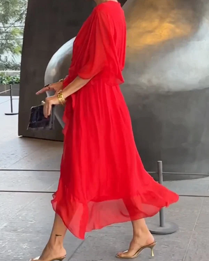 Side profile of red chiffon wrap midi dress with flutter sleeves