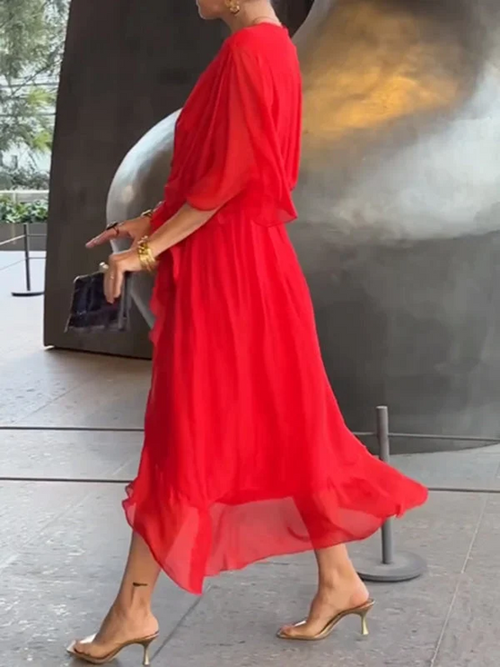 Side profile of red chiffon wrap midi dress with flutter sleeves
