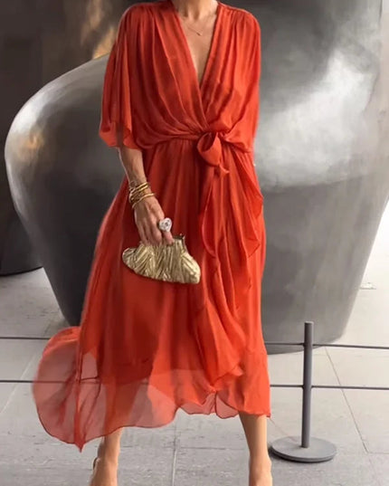 Red chiffon midi dress with v-neckline and tie waist, three-quarter view