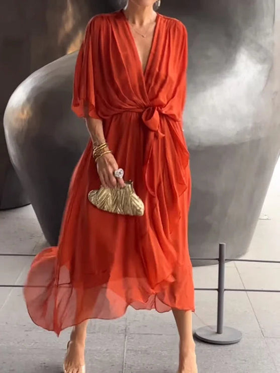 Red chiffon midi dress with v-neckline and tie waist, three-quarter view