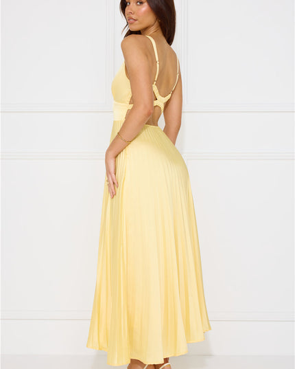 Back view of yellow maxi dress with criss cross straps and open back design
