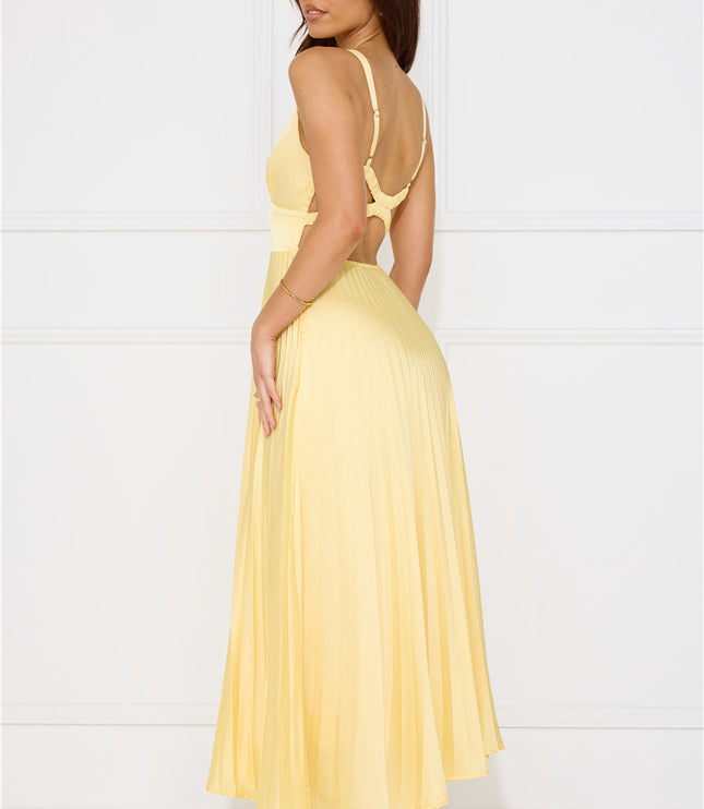 Back view of yellow maxi dress with criss cross straps and open back design