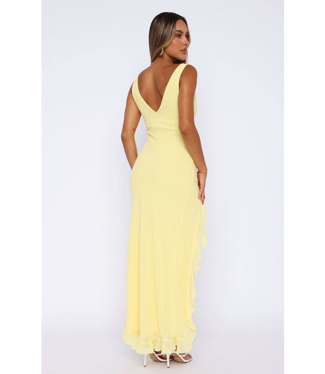 Back view of yellow sleeveless maxi dress with low v-neckline