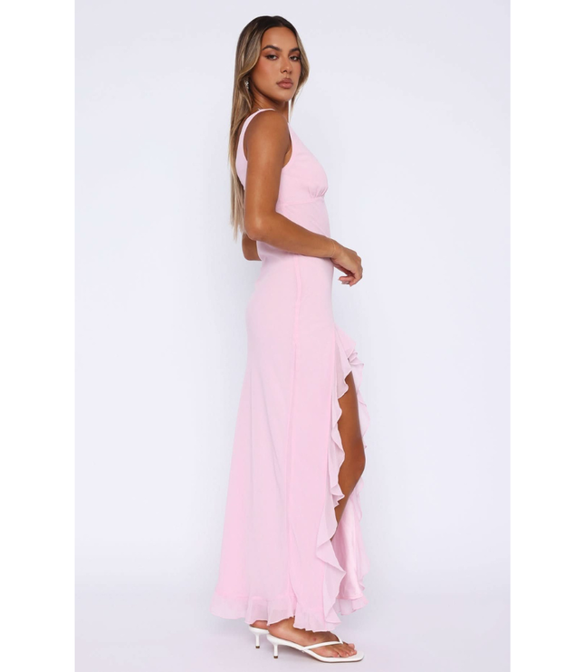 Side profile of pink sleeveless sundress with cascading ruffles