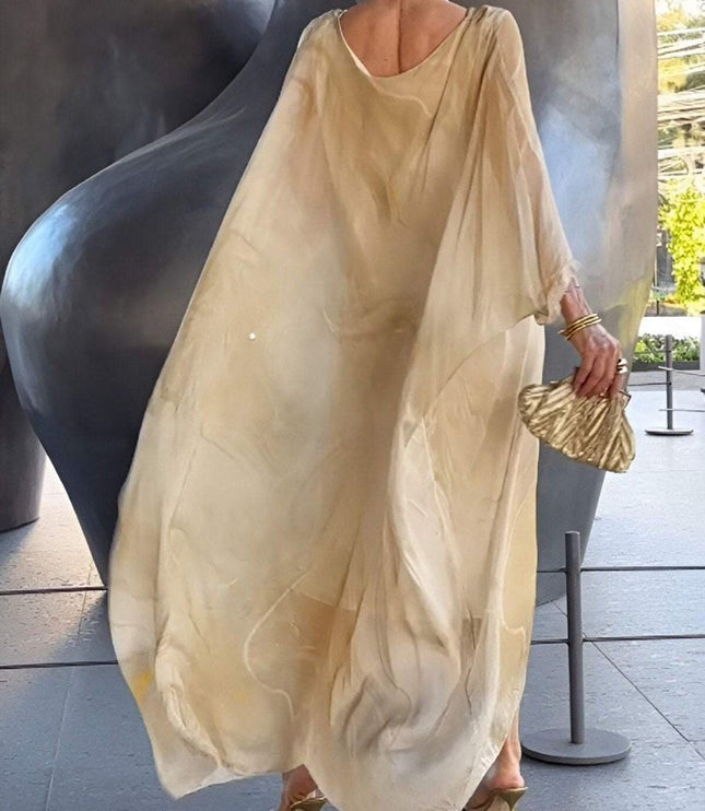 Back view of beige abstract print maxi dress with flowing sheer sleeves