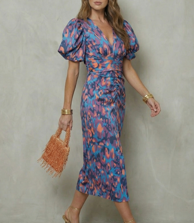 Side angle of women's abstract puff sleeve midi dress showing fit and V-neckline