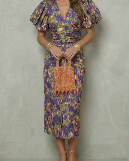 Women's abstract puff sleeve midi dress in green, purple, and gold tones with ruched waist
