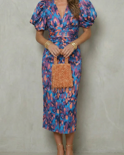 Women's abstract puff sleeve midi dress in blue and pink with deep V-neck and ruched waist