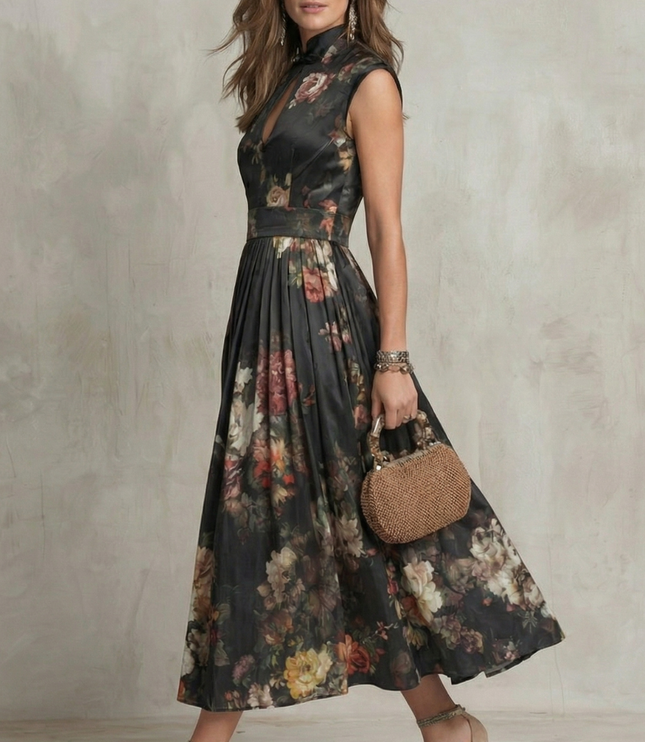 Side view of black floral midi dress showing sleeveless cut and flowing skirt