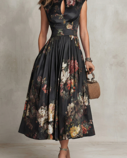 Front view of black floral midi dress with high neckline and sleeveless wedding guest style