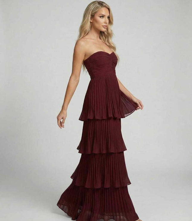 Burgundy strapless maxi dress with sweetheart neckline and layered pleated skirt