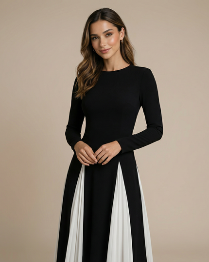 Front detail of black and cream colorblock maxi dress with long sleeves
