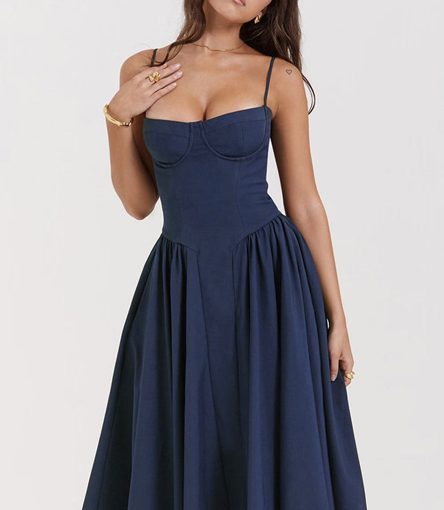 Front close-up of navy wedding guest midi dress with sweetheart corset bodice and thin straps