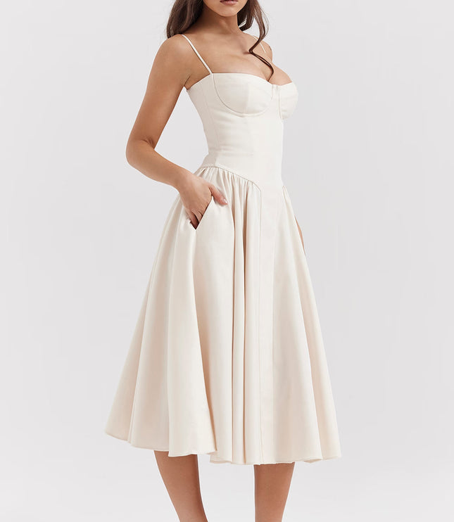 Cream midi dress with spaghetti straps, fitted bodice and full skirt for wedding guest style