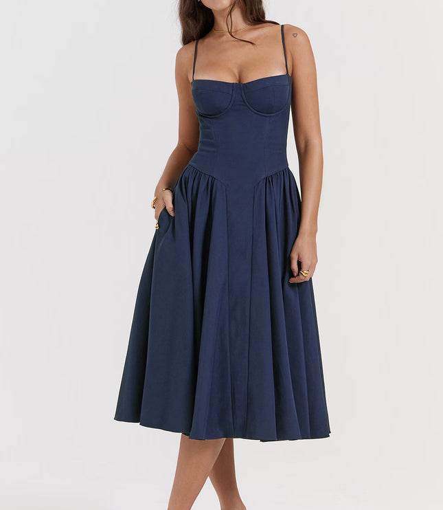 Angled front view of navy midi dress with fitted waist, thin straps, and gathered skirt