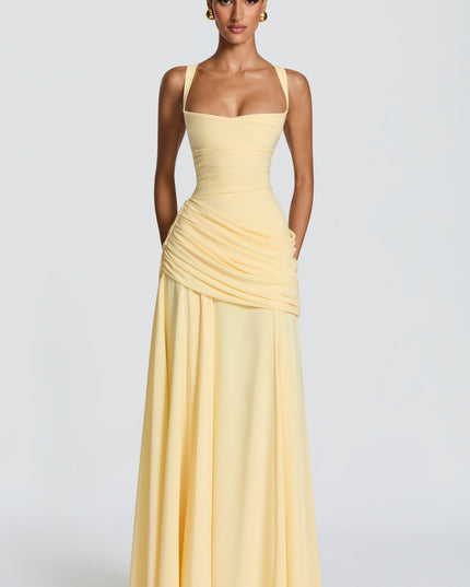 Close-up of pale yellow cowl neck maxi dress with wide straps and ruched waist drape