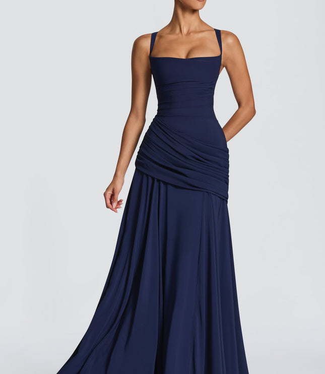 Studio front view of pale yellow cowl neck maxi dress with ruched hip detail and flowy hem