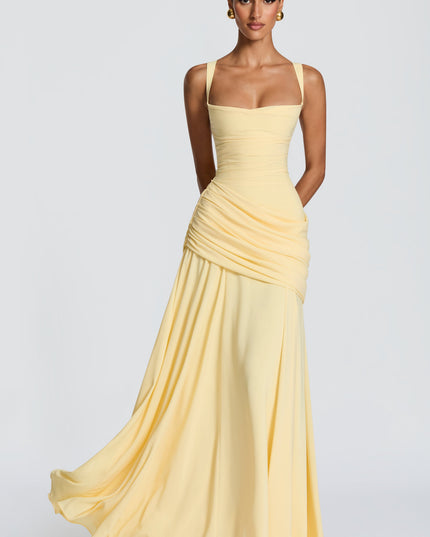 Navy cowl neck maxi dress in natural light, front view highlighting ruched wrap skirt and flowy hem