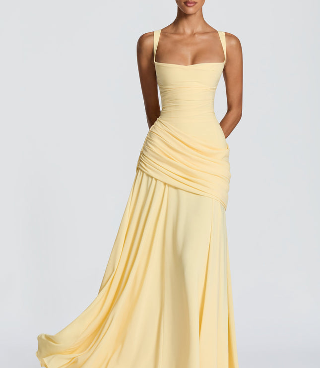 Navy cowl neck maxi dress in natural light, front view highlighting ruched wrap skirt and flowy hem