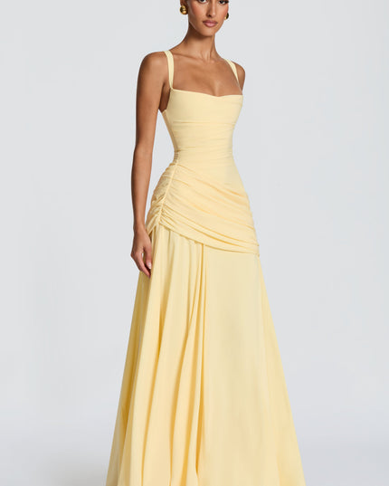 Back view pale yellow maxi dress with crisscross straps and lace-up corset back, ruched skirt
