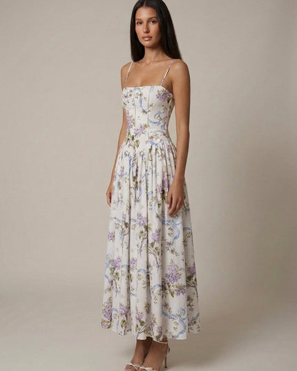 Front view of a floral corset midi dress with spaghetti straps and full skirt