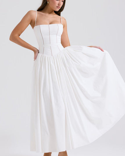 White corset midi dress shown with the skirt lifted to reveal the full flowing shape