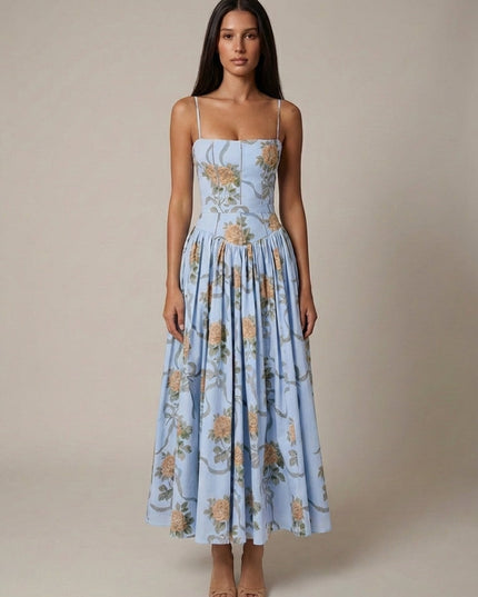 Rear angled view of cream floral corset midi dress showing straps, corset seams, and gathered skirt