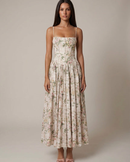 Back view of blue floral corset midi dress with fitted waist, square back, and long pleated skirt
