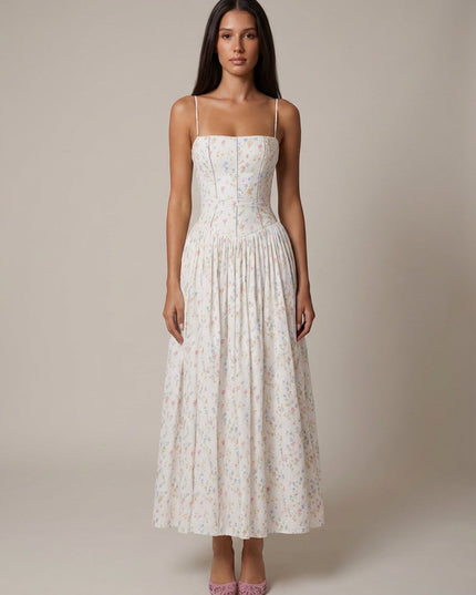 Women's floral corset midi dress with cream base, pastel print, spaghetti straps, and full pleated skirt
