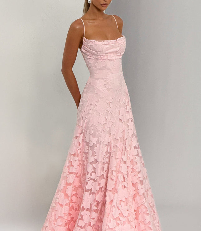 Side profile pink floral maxi dress with flowing skirt and side pockets