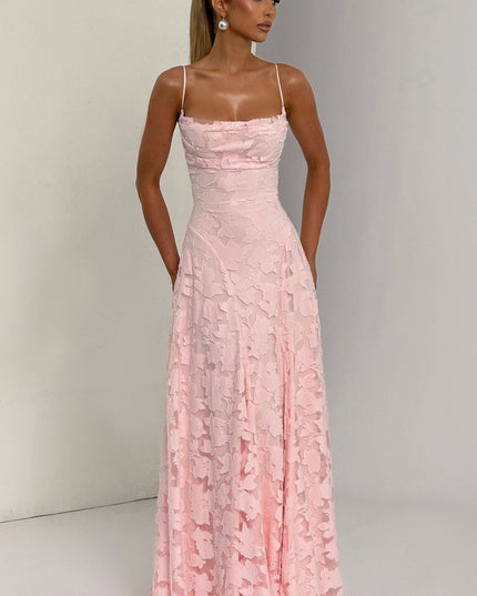 Close-up of pink floral lace texture on cowl neck maxi dress bodice