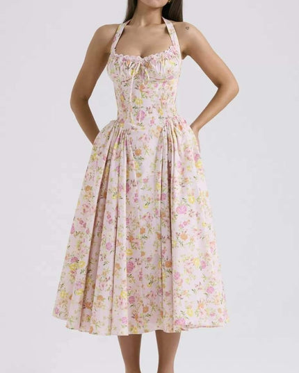Pink floral halter midi dress with gathered bodice and wide skirt for a summer dress look