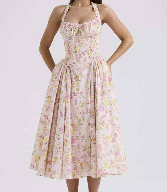 Pink floral halter midi dress with gathered bodice and wide skirt for a summer dress look