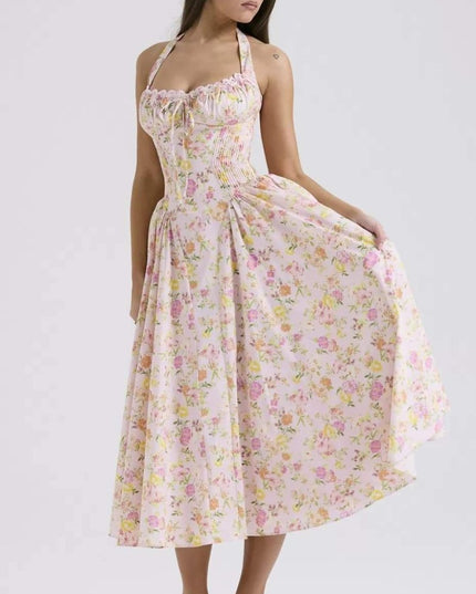 Studio front view of floral halter midi dress with corset-style waist and midi length