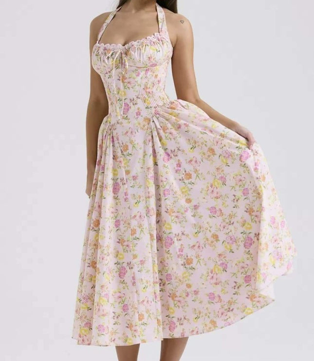 Studio front view of floral halter midi dress with corset-style waist and midi length