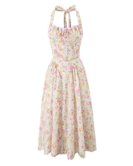 Hanging pink floral halter midi dress with ruched top and full skirt on white background