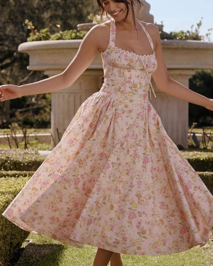 Pink floral halter midi dress with full skirt, ideal wedding guest dress for women