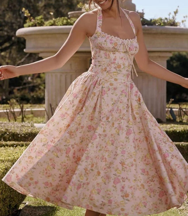 Pink floral halter midi dress with full skirt, ideal wedding guest dress for women