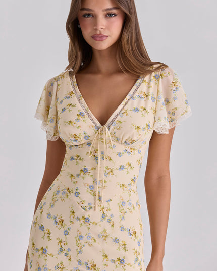 Rear view of a floral summer maxi dress with fitted waist and full-length skirt