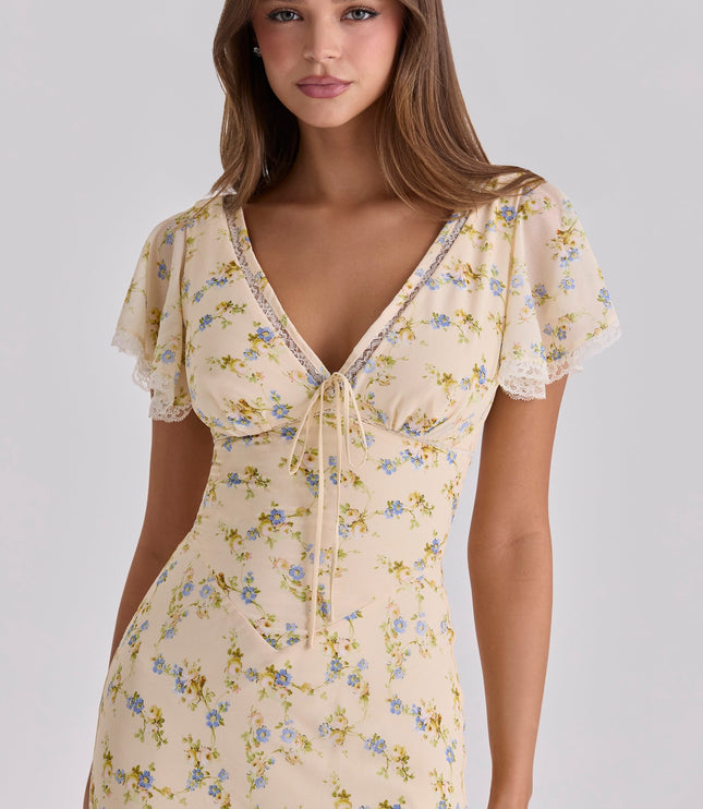 Rear view of a floral summer maxi dress with fitted waist and full-length skirt