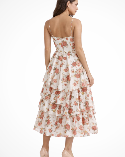 Back view of floral midi dress with fitted bodice and layered ruffle skirt