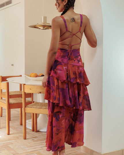 Back view of red and purple floral maxi dress with crossback straps and ruffle layers