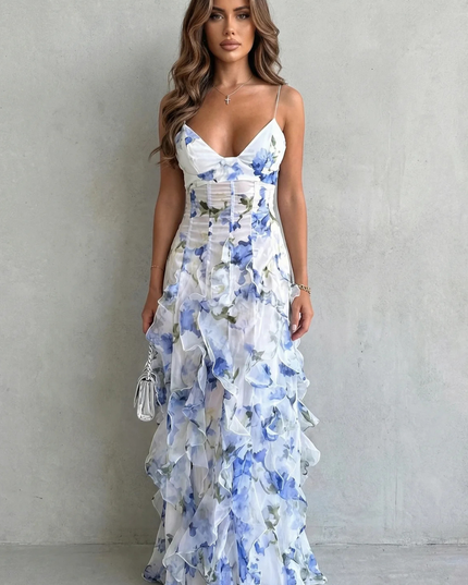 Front view of blue and white floral wedding guest maxi dress with ruffle tiers