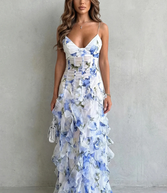 Front view of blue and white floral wedding guest maxi dress with ruffle tiers