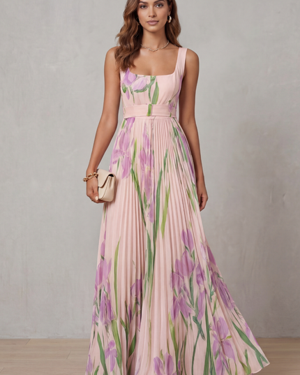 Front view of a pink floral wedding guest maxi dress with square neckline and flowing pleats