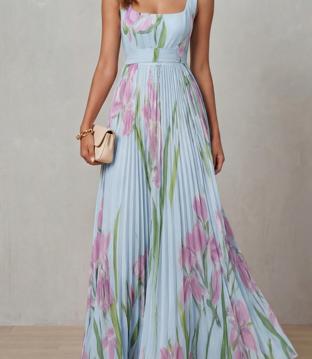 Back view of a pink floral wedding guest maxi dress with square back and pleated skirt