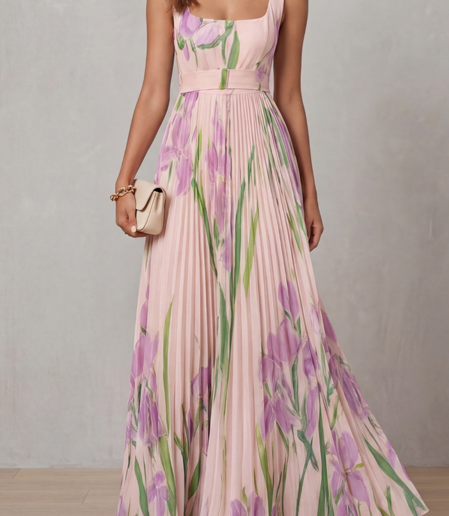 Front view of a pink floral square neck maxi dress with pleated skirt and waist belt