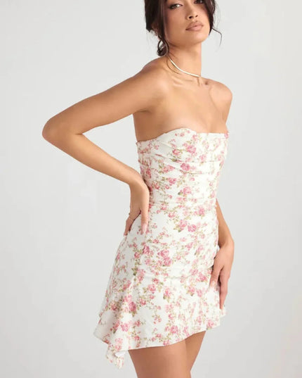 Side back view of a women's wedding guest floral strapless mini dress with fitted waist and flared skirt