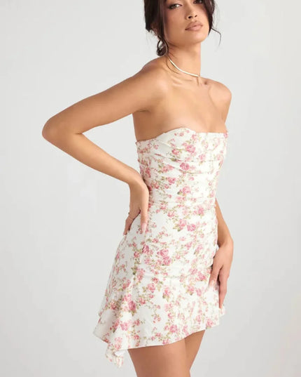 Side back view of a women's wedding guest floral strapless mini dress with fitted waist and flared skirt